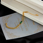 Bracelete de Ouro com Barra e Esmeralda